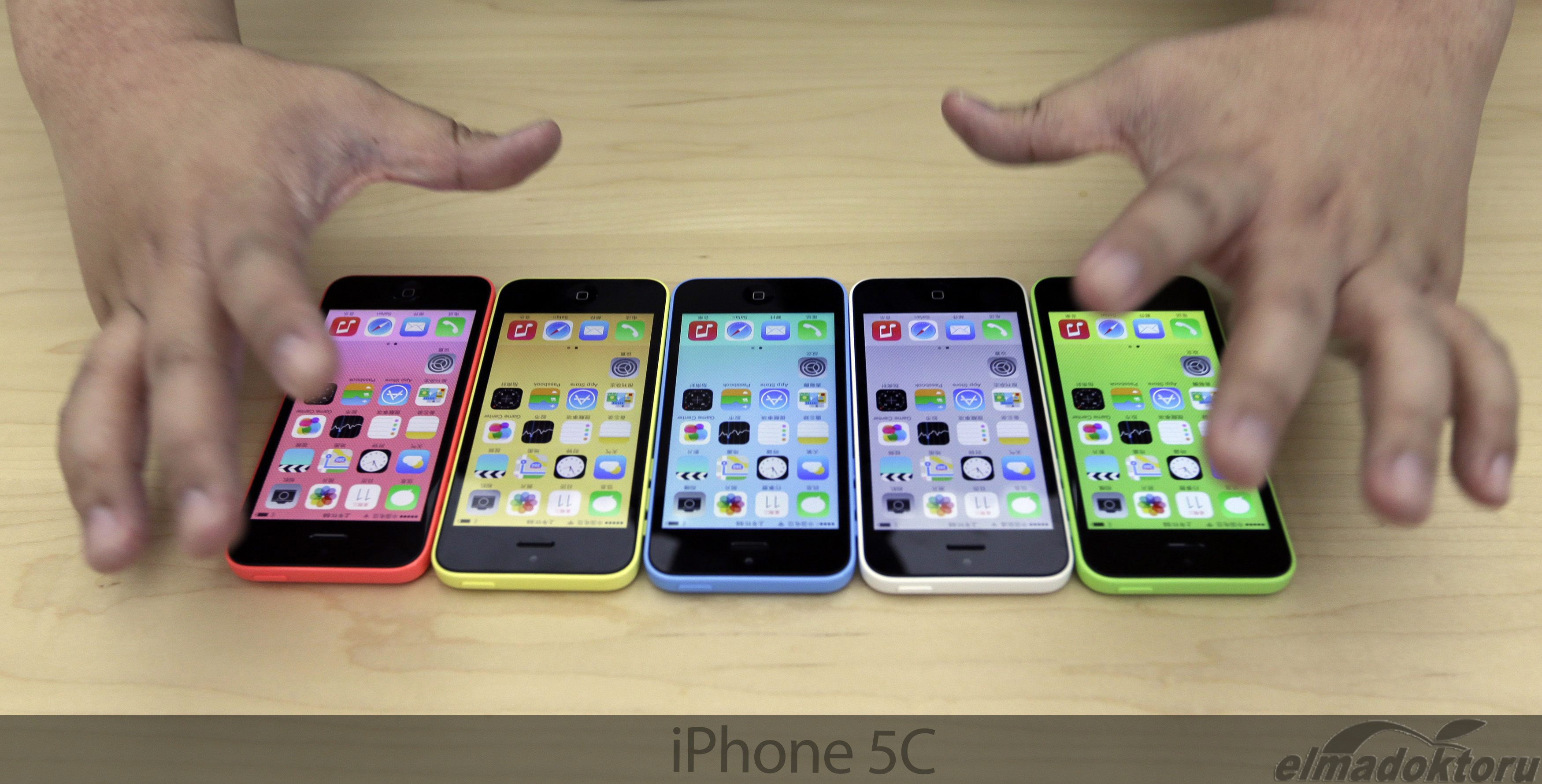 The new iPhone 5C in five colours are placed together at Apple Inc's announcement event in Beijing